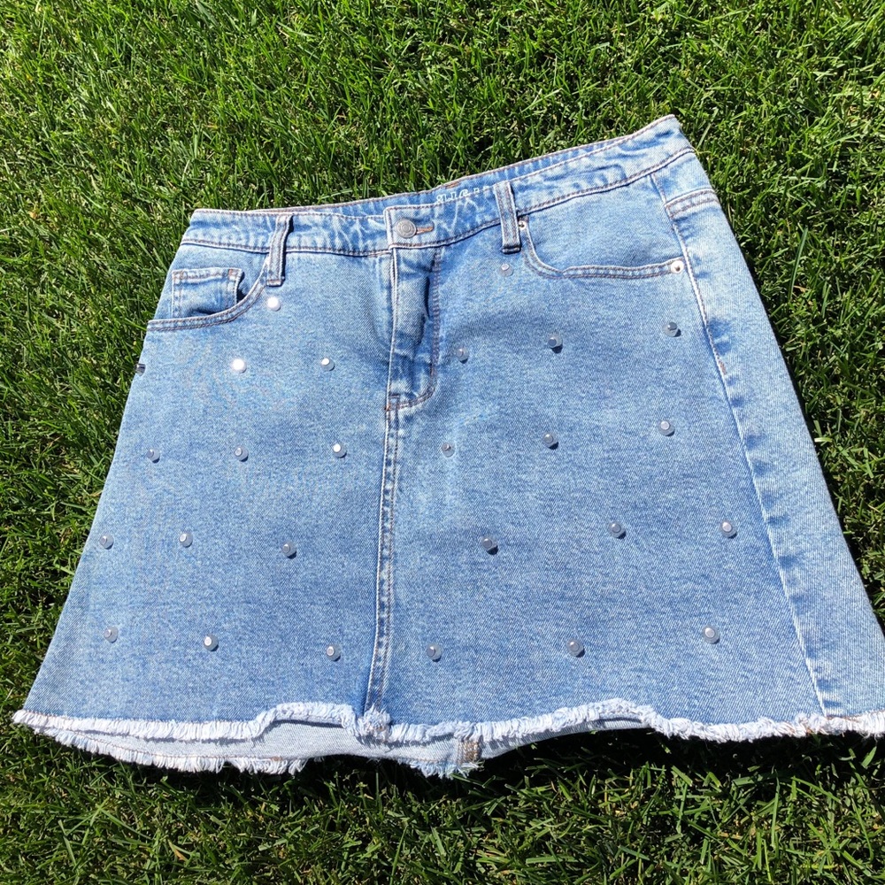 Jean skirt w/ metal spikes on front half of skirt.